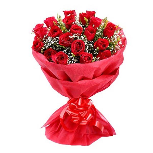 Red roses and green leaves wrapped with red paper