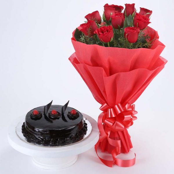 10 red roses with green leaves wrapped in red paper and tied with red ribbon and half kg chocolate truffle cake